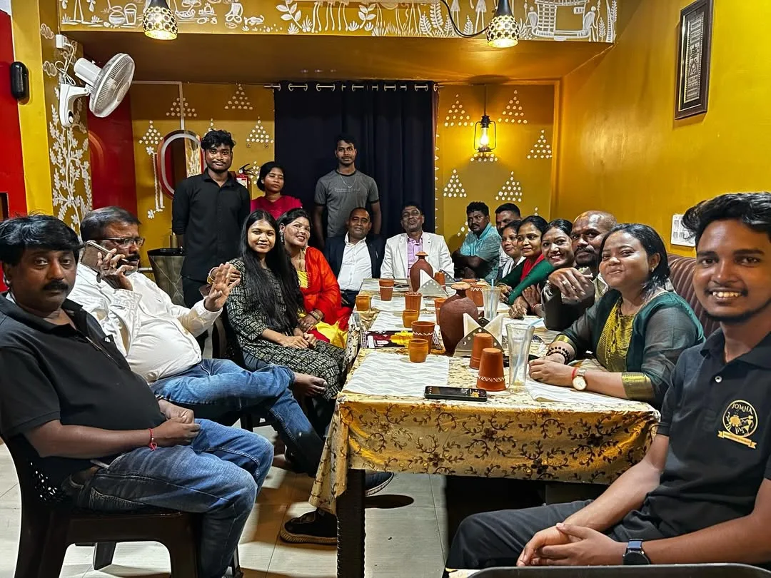 Guests enjoying communal dining experience at JOMHA Restaurant